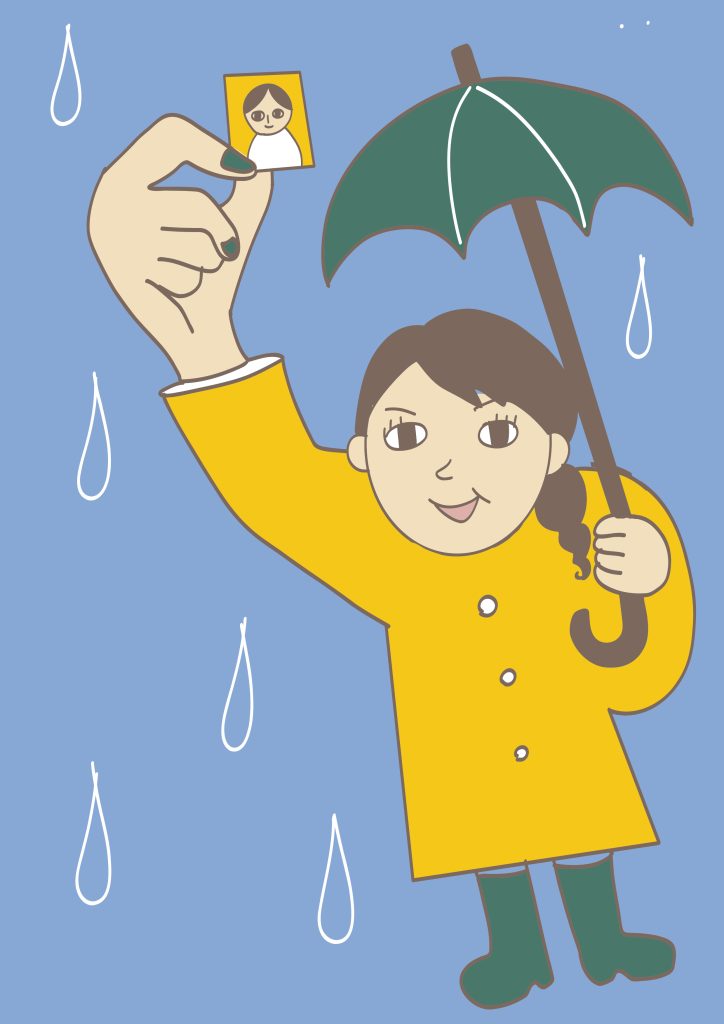 雨の日でも大丈夫と、免許証用の写真を掲げる女性。